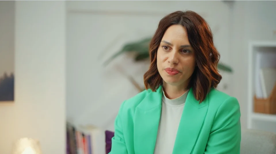 a woman in a green shirt