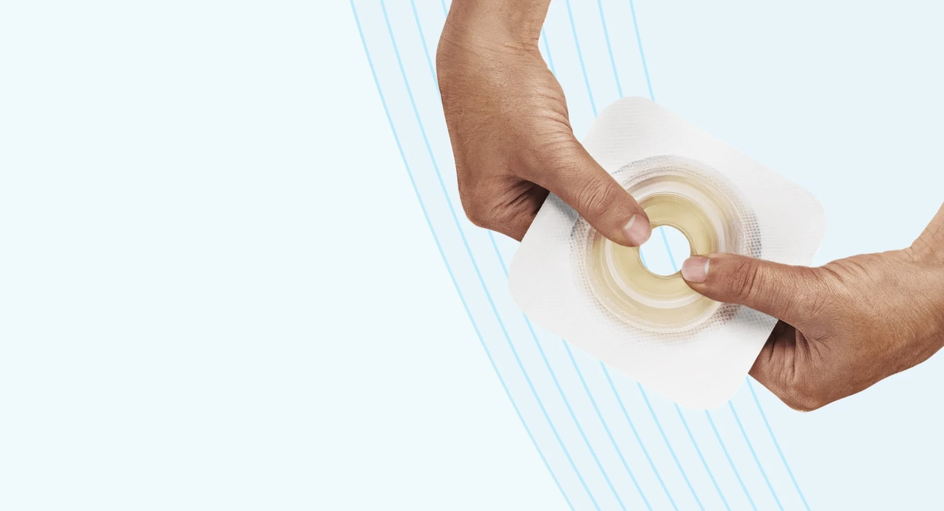 hands holding an adhesive