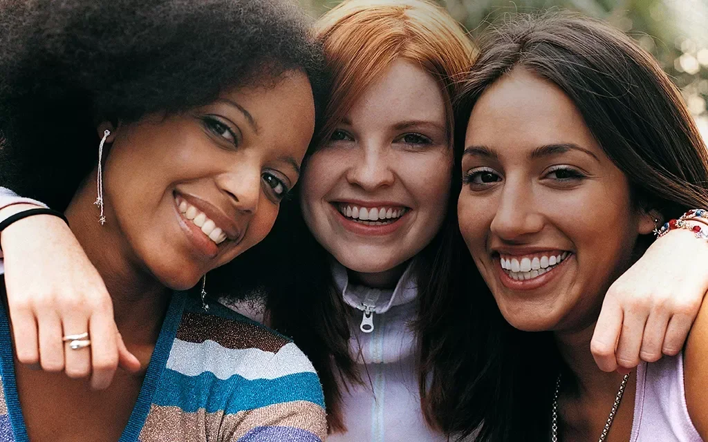 a group of women smiling
