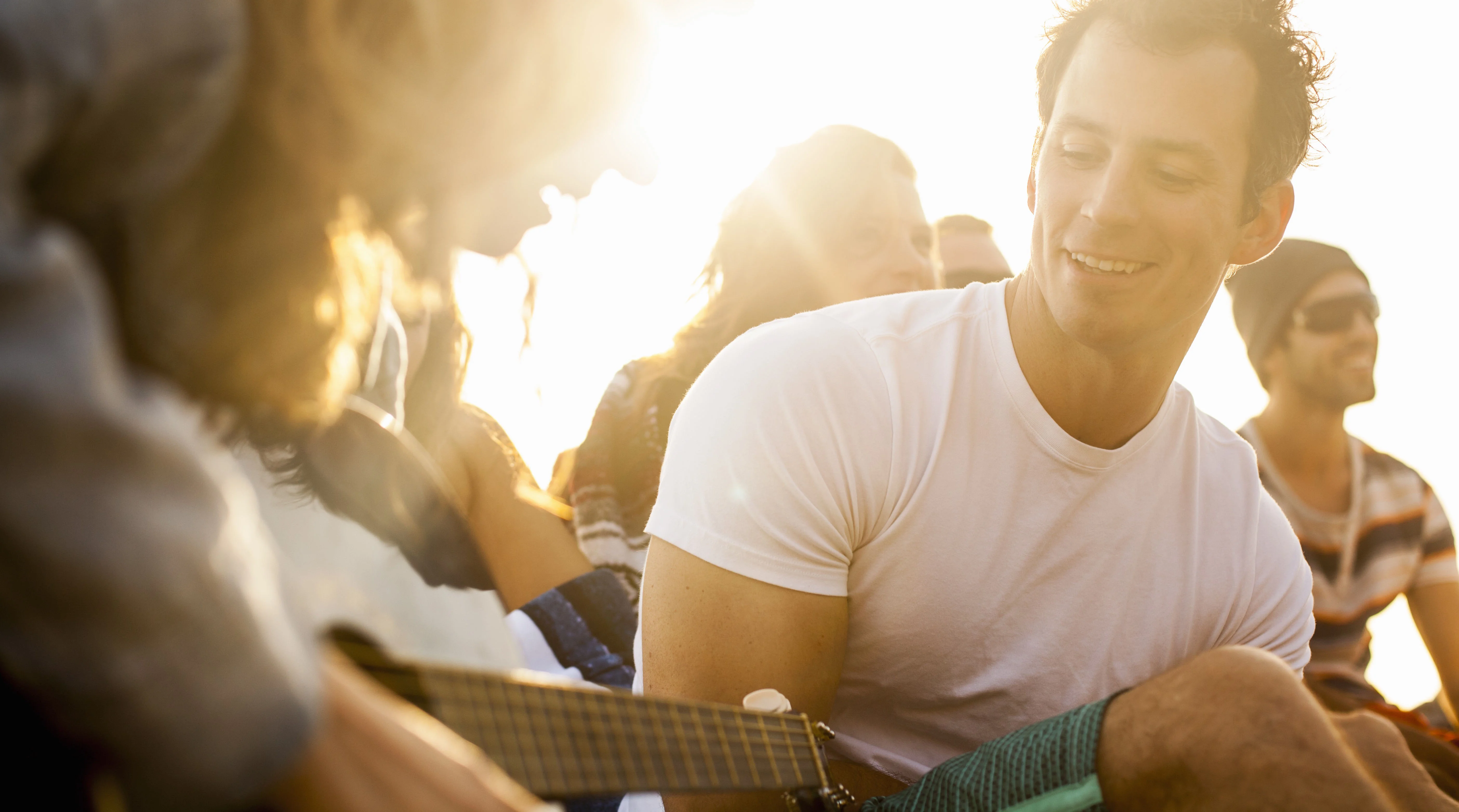 a man playing a guitar