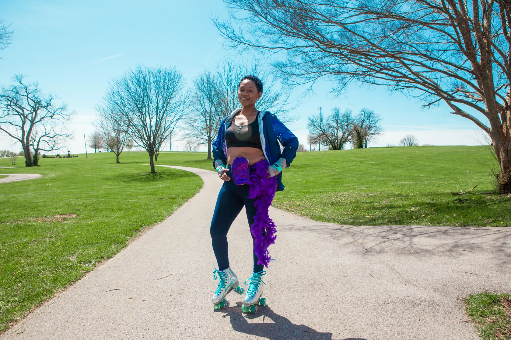 woman with ostomy pouch posing in park
