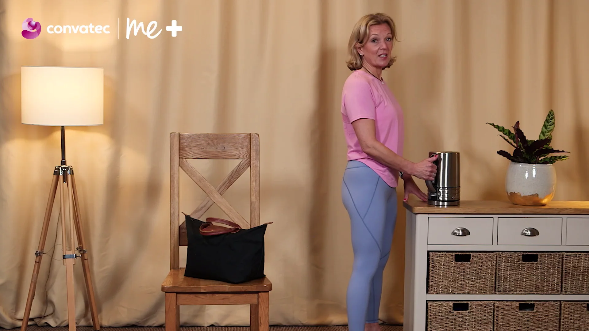 a person holding a coffee pot